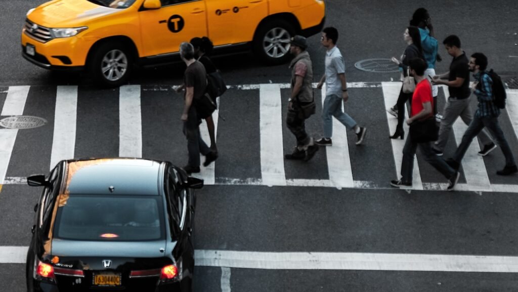 arial view of folks crossing the street in New York City